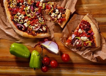 Pizza &quot;horiatiki&quot; with feta cheese, sausage and fresh tomato